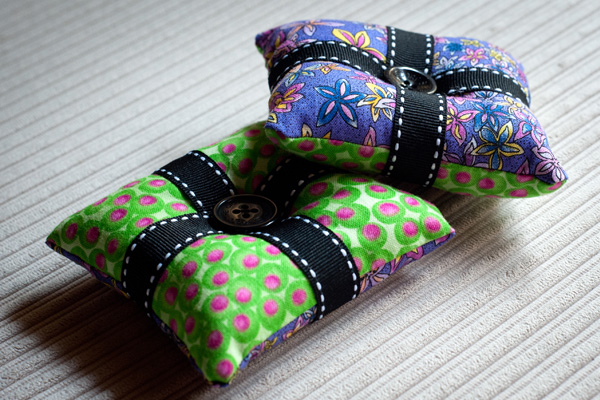 Green and purple pin cushions